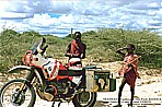 1990_KENYA_native Massais in AMBOSELI NATIONAL PARK meet BMW motorcycle_2 different worlds_they were staring one hour alternately to the bike, to me and the other way round, they couldnt really believe it, that somebody crossed their wild National-Park with such a huge motor- cycle ... _my motorcycle-trip KENYA to SOUTH AFRICA